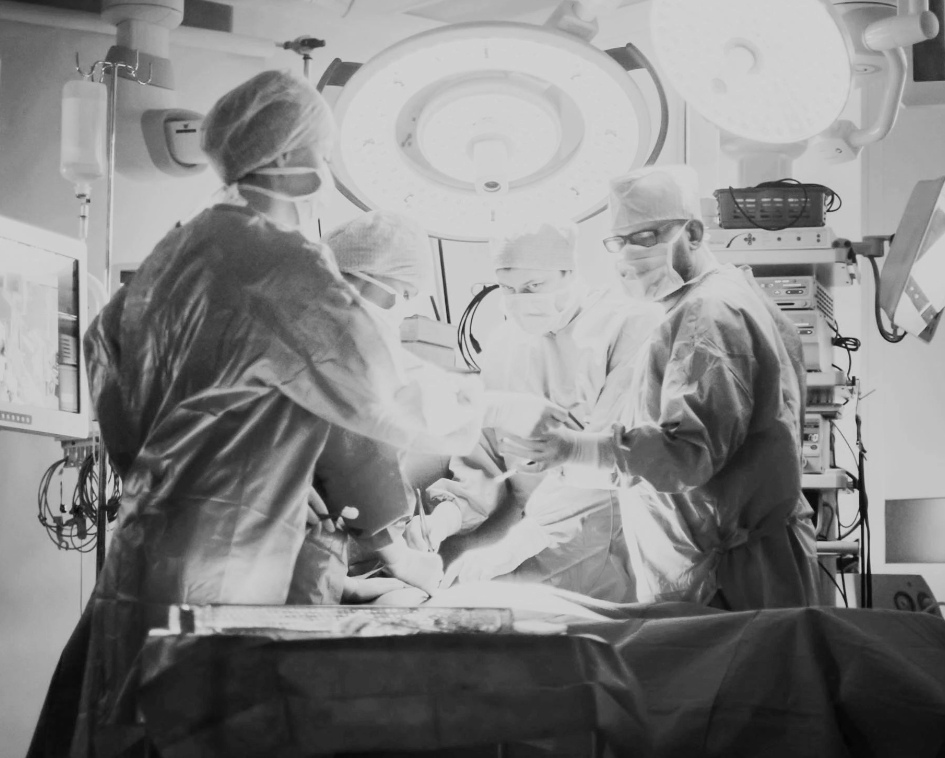 black and white image of physicians in surgical room