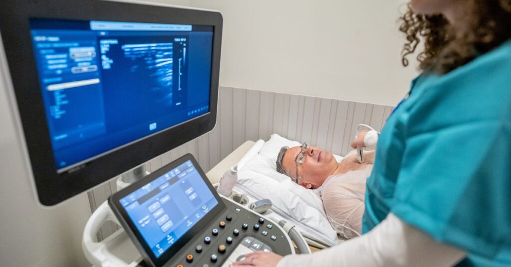 healthcare provider performing echocardiogram exam on machine with AI capabilities