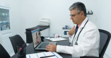 Physician conducting telehealth consultation to improve rural healthcare recruitment