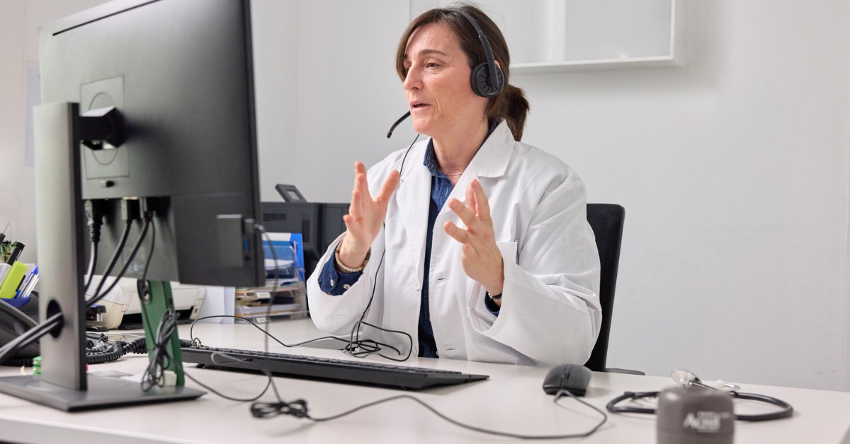 physician holds telehealth video call from office